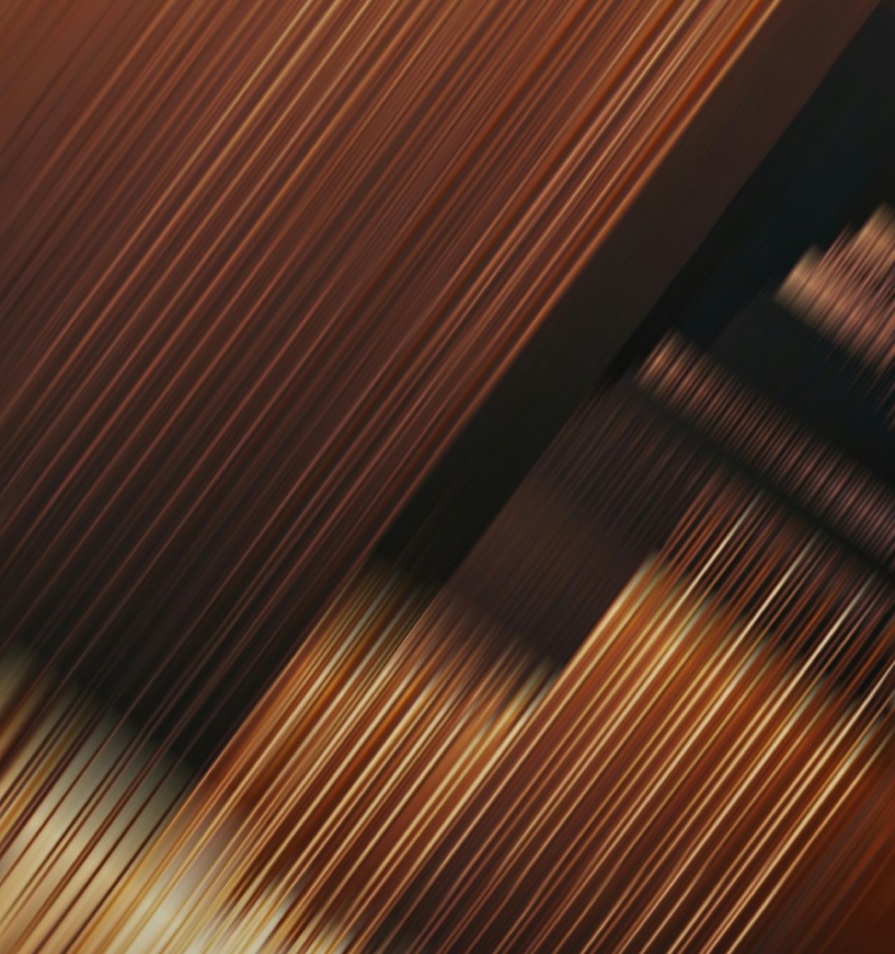 Close-up of a yellow-orange striped fabric; Photo by D21_Gallery on Unsplash.